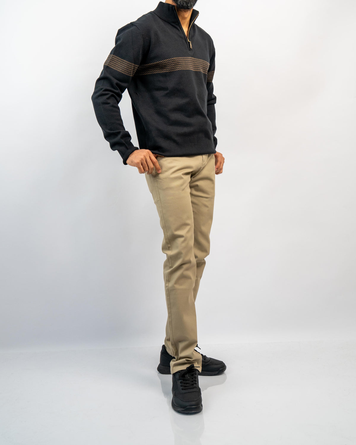 MANLY Knitwear & Sweaters — men's black half-zip knit pullover with tan chest stripe, worn with khaki trousers