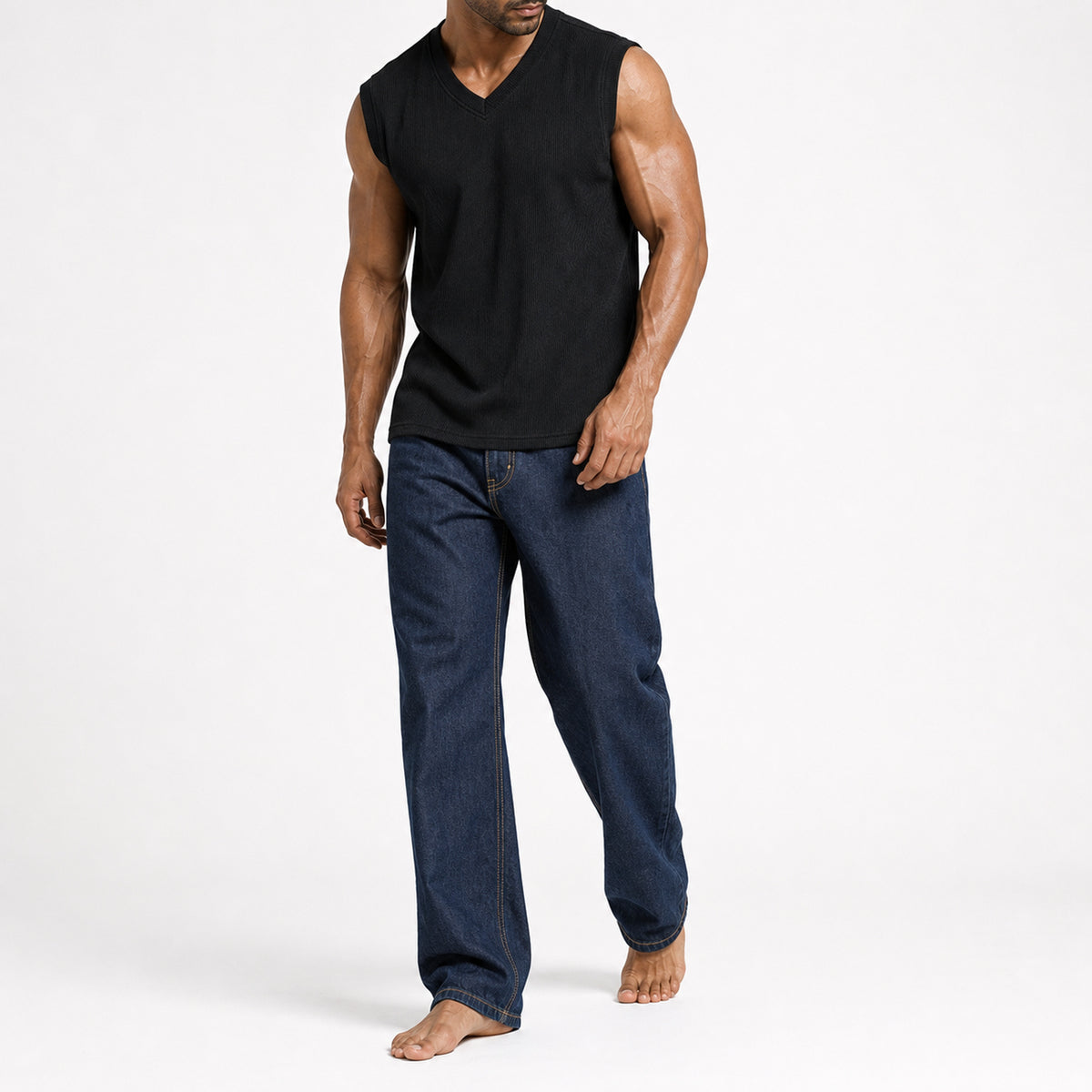 Man in the black ribbed v-neck tank with dark jeans, full view