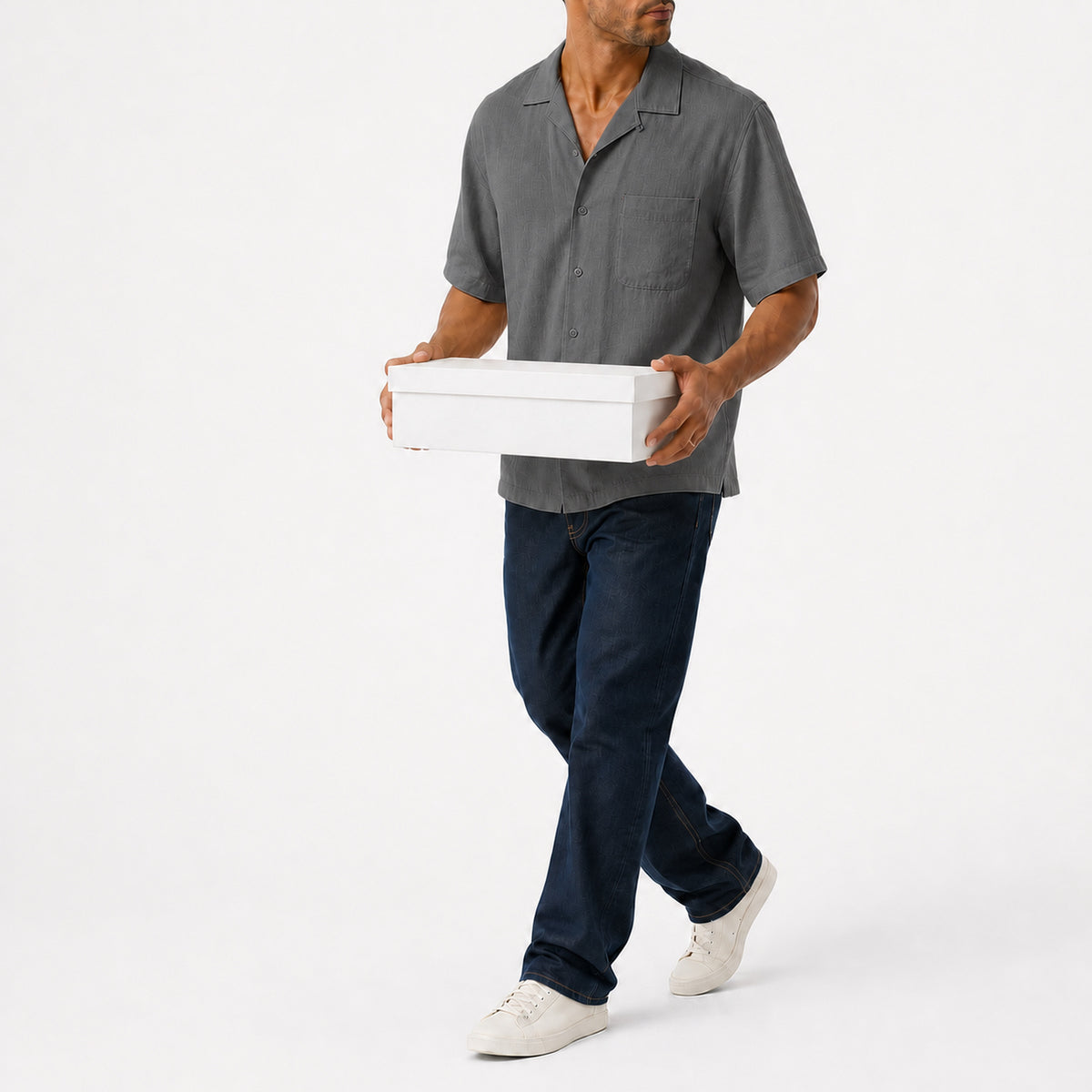 Man wearing the grey lyocell camp shirt with navy trousers, full view