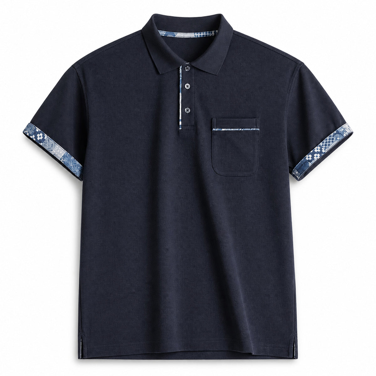 Navy pocket polo with indigo pattern trim at cuffs, flat front view